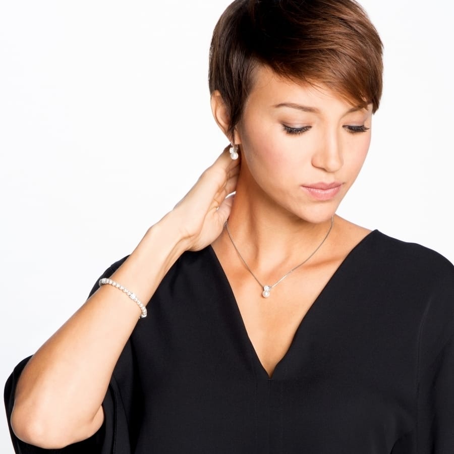 Model wearing a Brighton silver-plated pearl pendant necklace paired with matching pearl bracelet and stud earrings