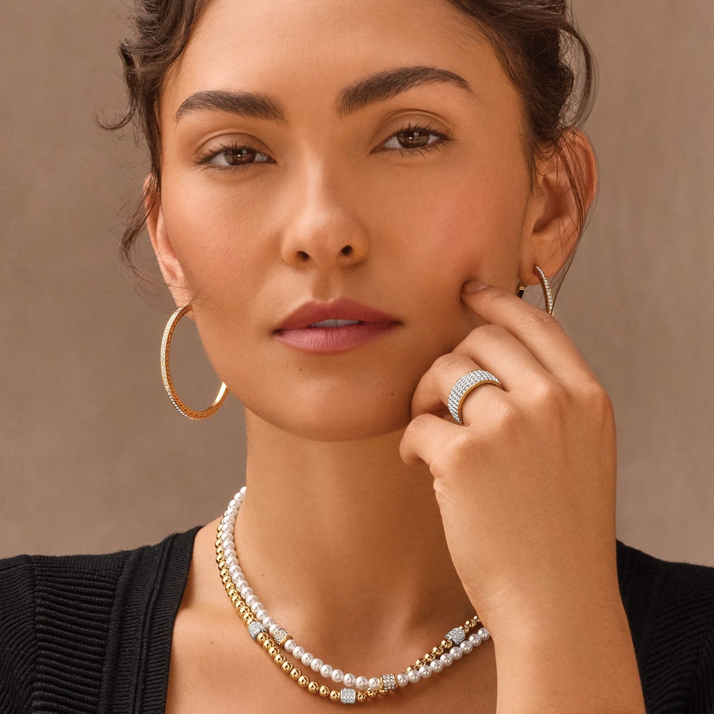 Model wearing Brighton two-tone crystal hoop earrings with coordinating Brighton pearl necklaces and crystal pavé ring