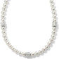 Brighton pearl necklace with three silver-plated crystal pavé rondelle accents spaced along the strand on a white background