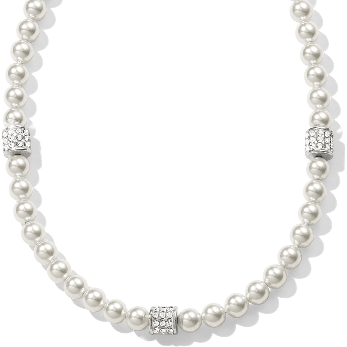 Brighton pearl necklace with three silver-plated crystal pavé rondelle accents spaced along the strand on a white background