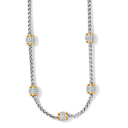 Brighton necklace with silver-plated wheat chain and five gold-plated barrel stations set with crystals on a white background