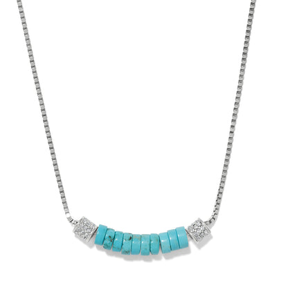 Brighton necklace with turquoise disc beads and silver-plated crystal accent stations on a fine chain, on a white background