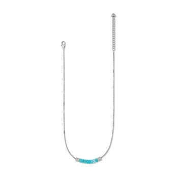 Brighton silver-plated necklace with turquoise beads, crystal accents, box chain, and lobster clasp on a white background