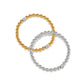 Model wearing Meridian Petite Stretch Bracelet in silver with matching necklace while looking at you