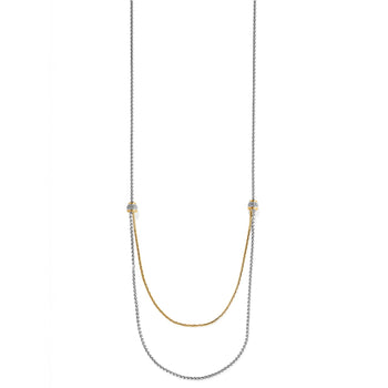 Brighton two-tone layered chain necklace with crystal-set beaded stations and draped gold and silver strands on a white background