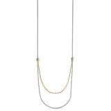 Brighton two-tone layered chain necklace with crystal-set beaded stations and draped gold and silver strands on a white background