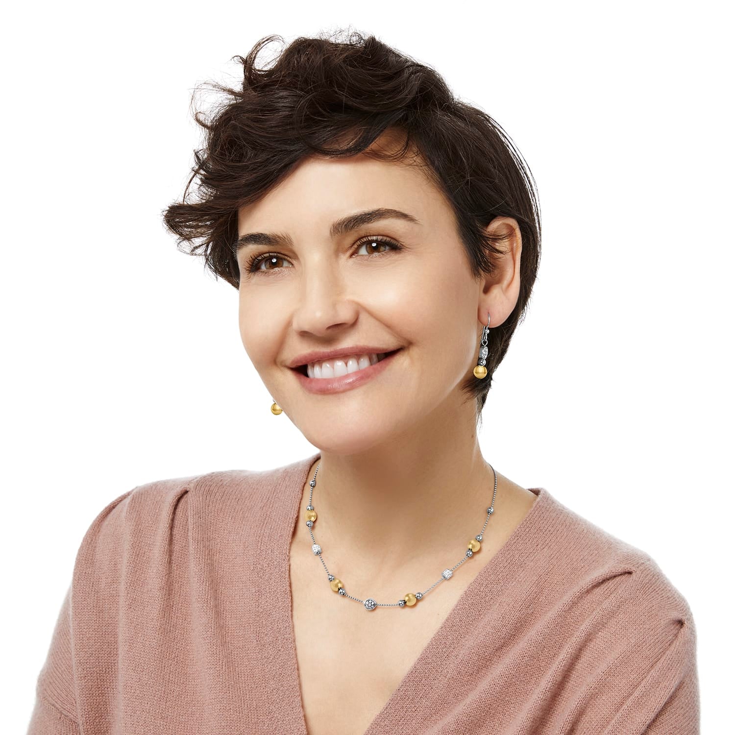 Model wearing Brighton two-tone drop earrings with gold beads paired with a matching beaded crystal station necklace