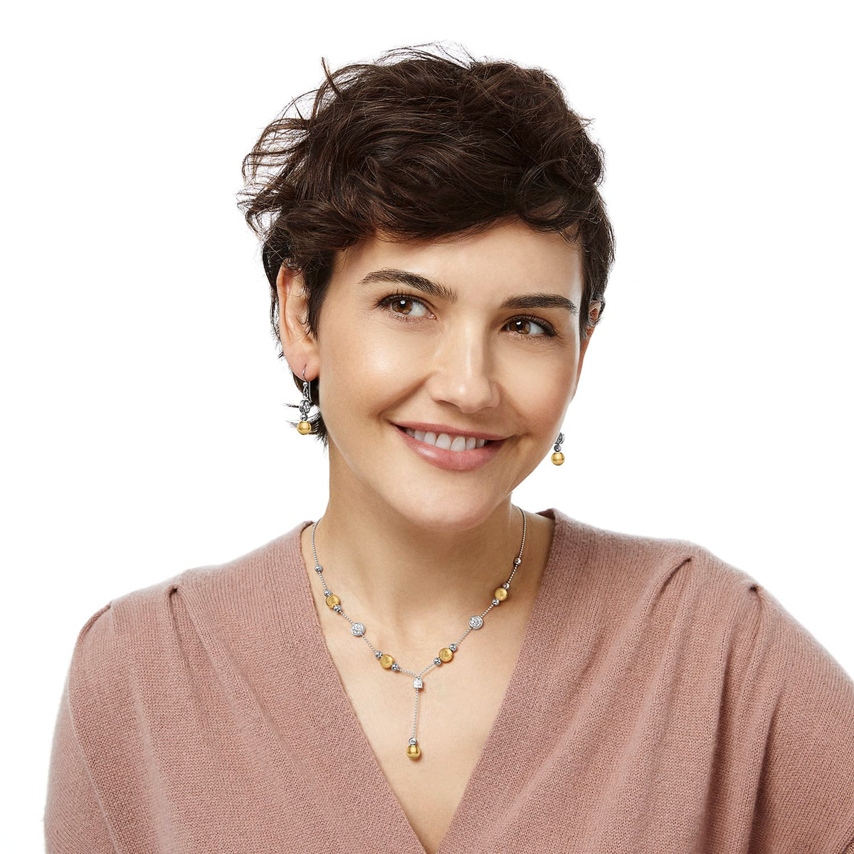 Model wearing Brighton two-tone drop earrings with gold beads paired with matching lariat necklace featuring crystal accents