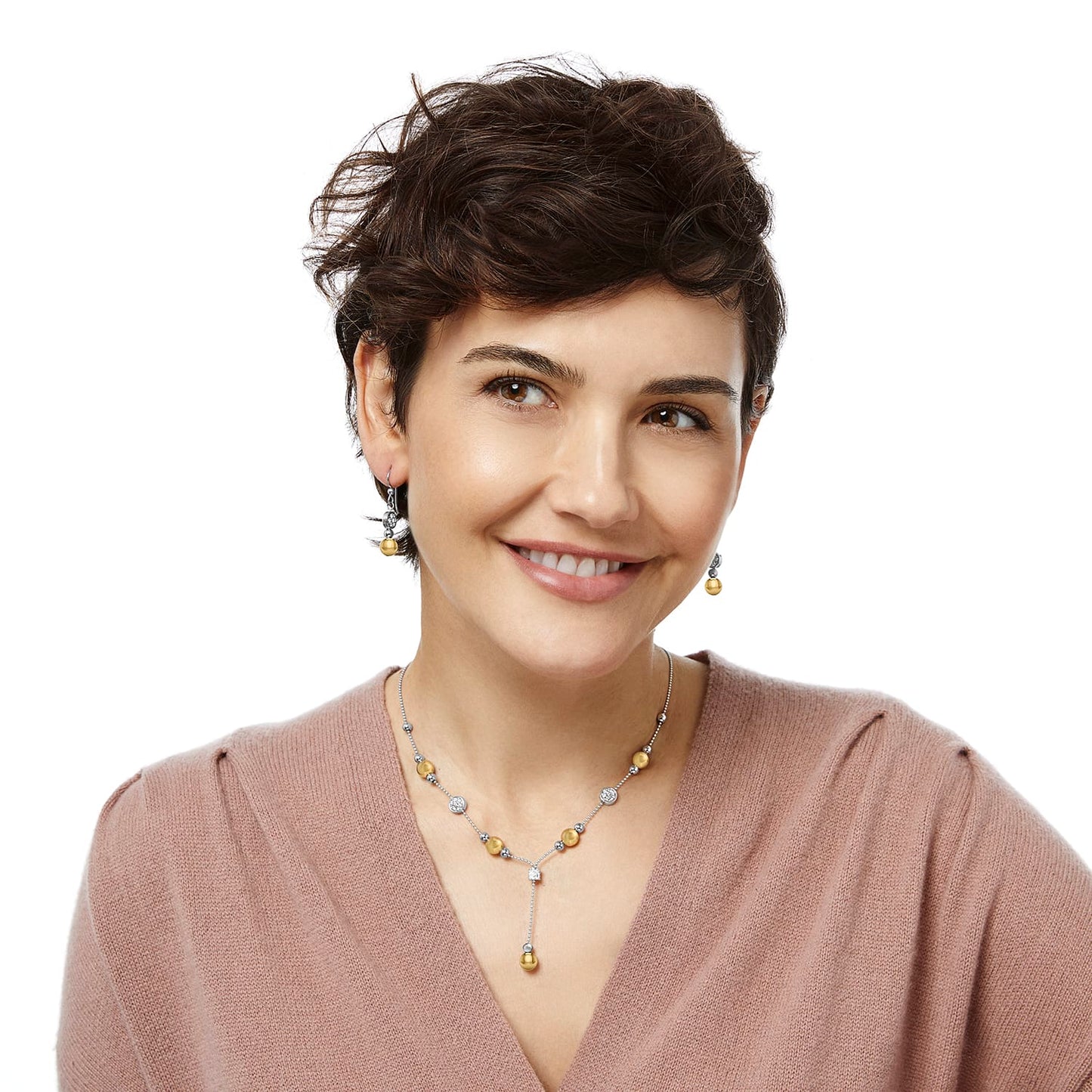 Model wearing Brighton two-tone drop earrings with gold beads paired with matching lariat necklace featuring crystal accents