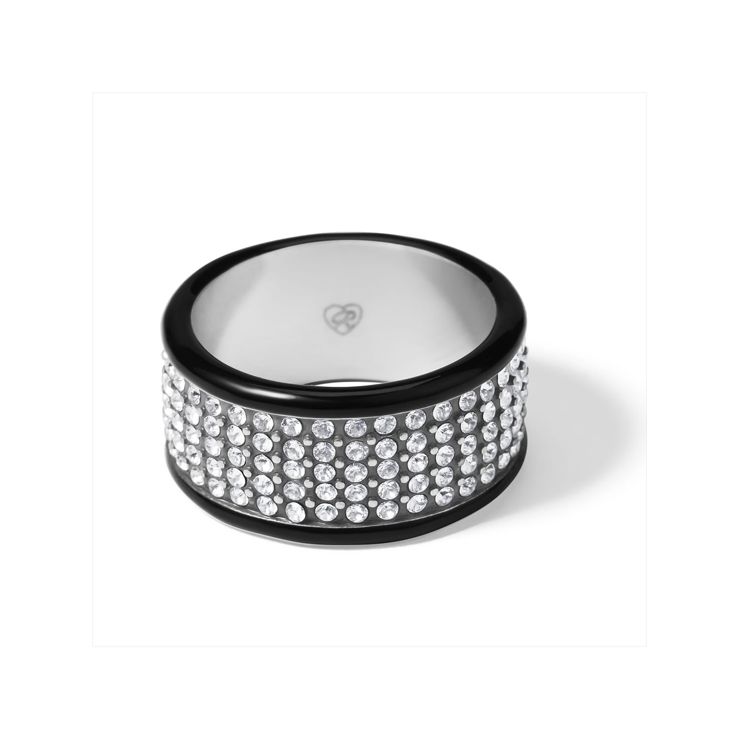 Brighton ring with wide crystal pavé band and black lacquer edges on a white background