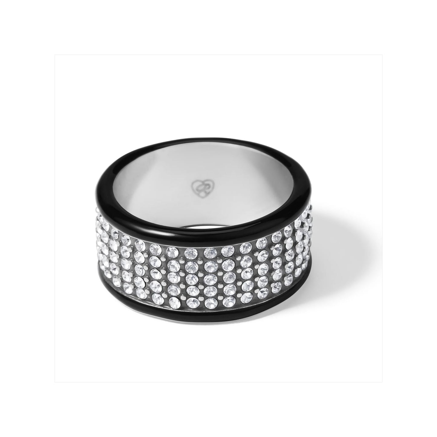 Brighton ring with wide crystal pavé band and black lacquer edges on a white background