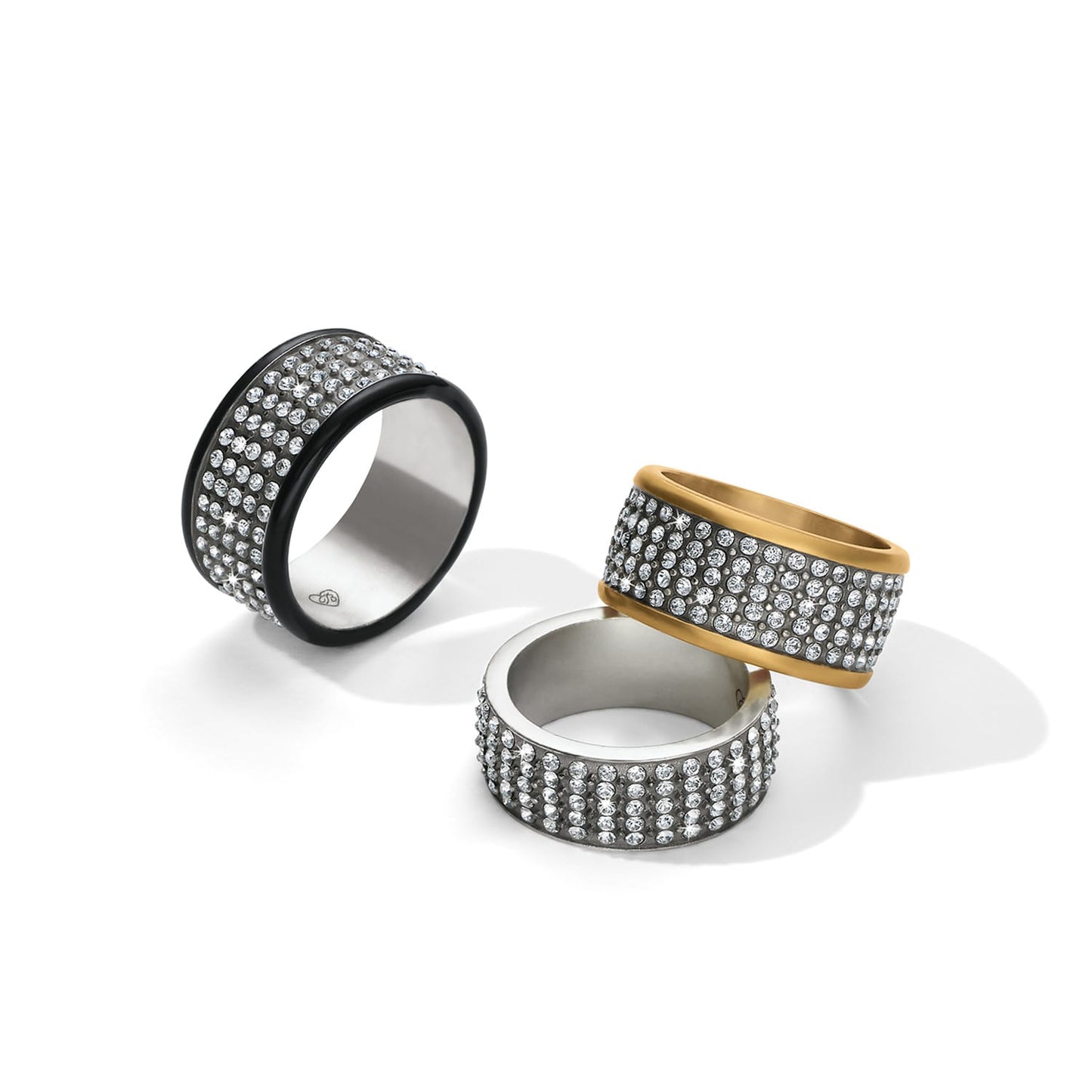 Brighton three crystal pavé band rings with black lacquer, gold-plated, and silver-plated edges on a white background