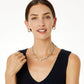 Model wearing a Brighton silver twisted rope necklace with gold and crystal stations and coordinating Brighton accessories