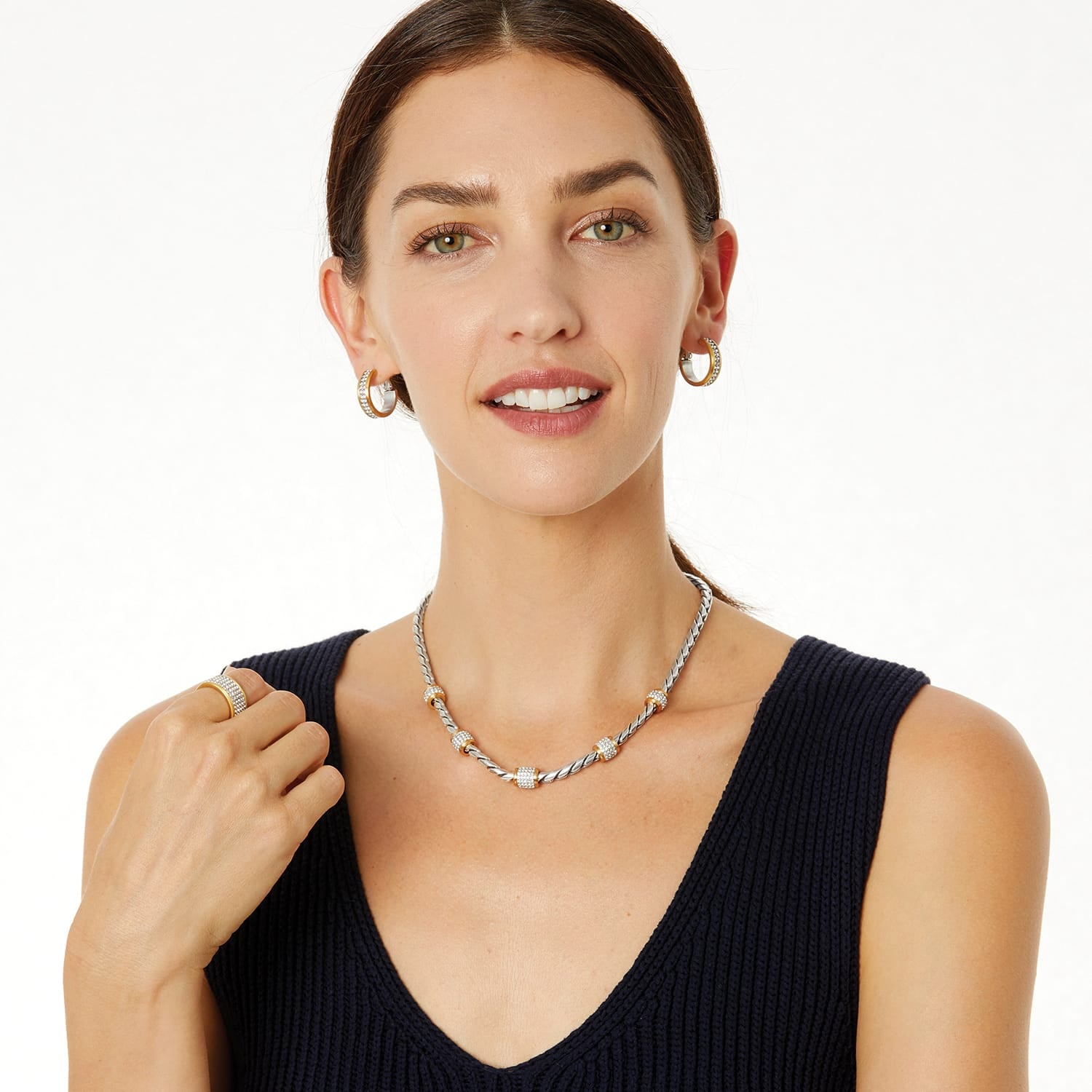 Model wearing a Brighton silver twisted rope necklace with gold and crystal stations and coordinating Brighton accessories