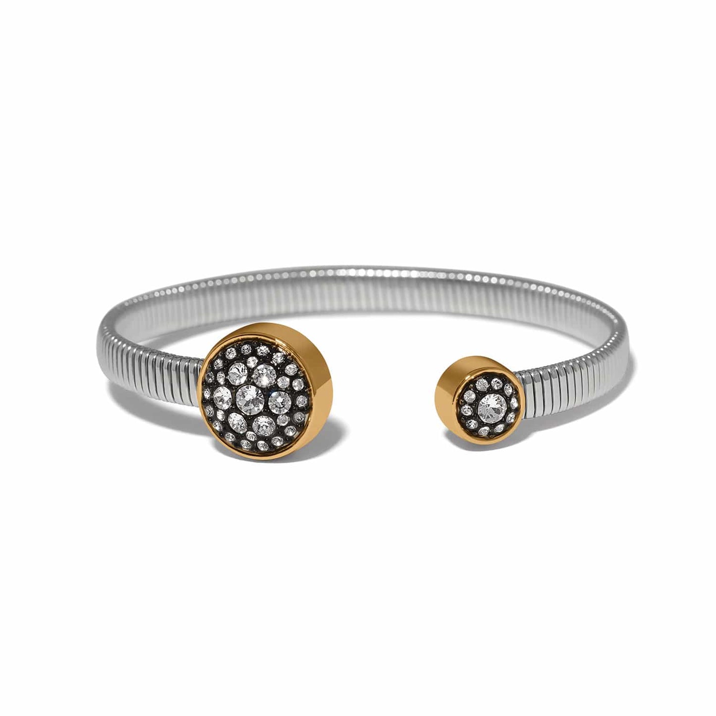 Brighton two-tone cuff bracelet with gold-tone crystal-set discs and silver-tone ribbed band on a white background