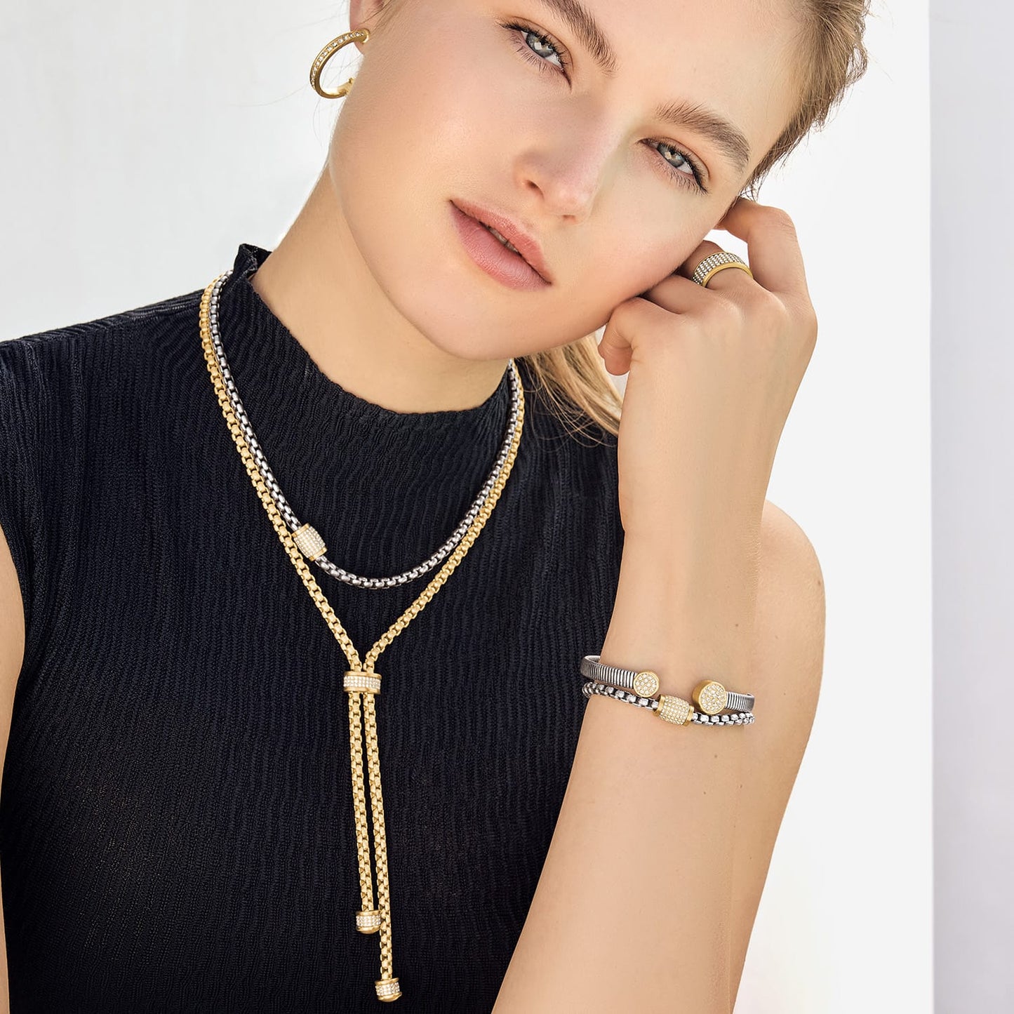 Model wearing a Brighton two-tone lariat necklace with crystal accents and coordinating Brighton accessories
