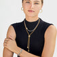 Model wearing a Brighton two-tone lariat necklace with crystal accents and coordinating Brighton accessories