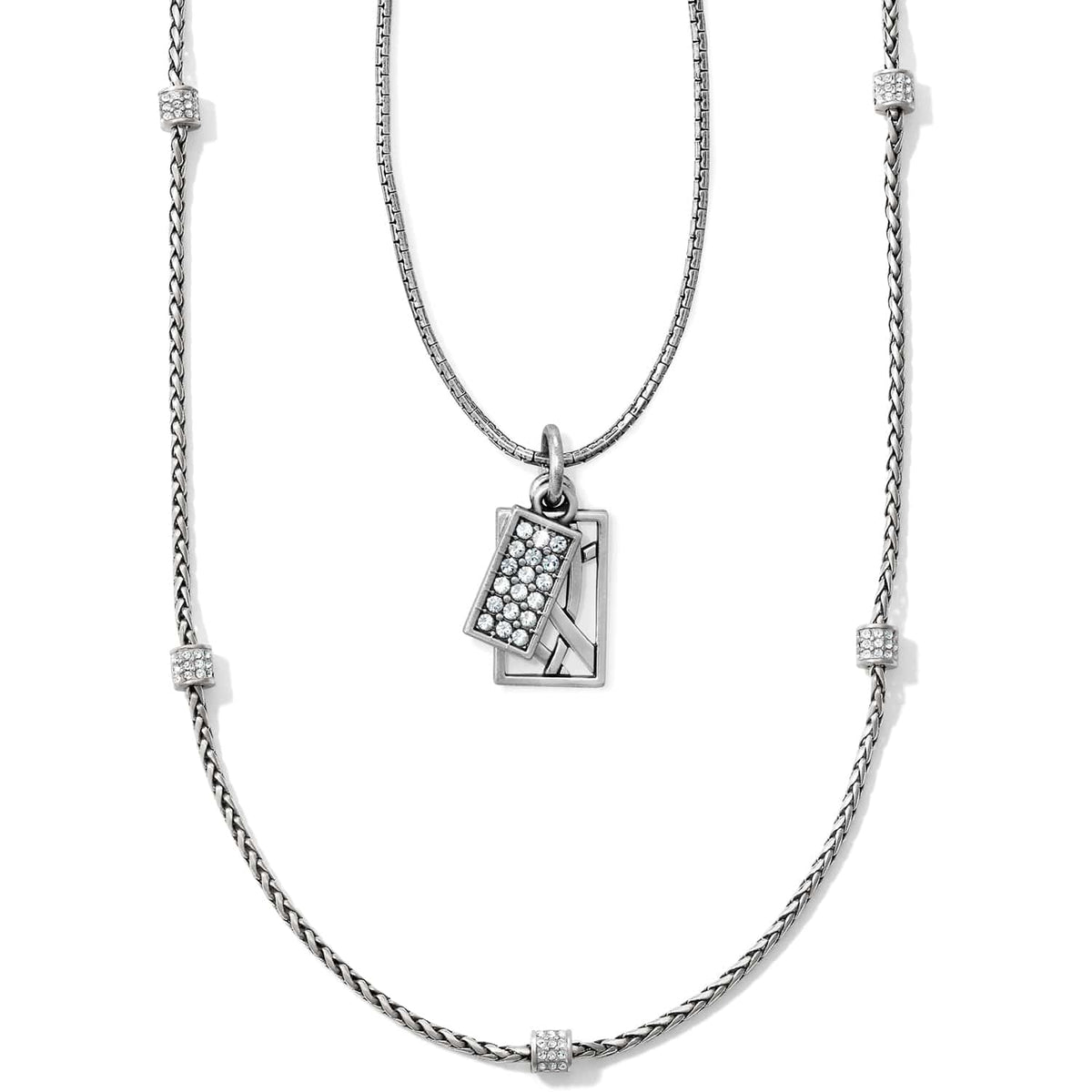 Brighton layered pendant necklace with silver-tone chains, crystal-set stations, and rectangular crystal pave charm on a white background