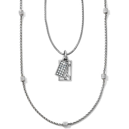 Brighton layered pendant necklace with silver-tone chains, crystal-set stations, and rectangular crystal pave charm on a white background