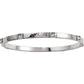 Brighton bangle bracelet with hammered silver-tone finish and small blue crystal accents on a white background
