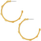 Brighton hoop earrings with gold-plated finish and notched textured edge design on a white background