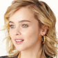 Model wearing a Brighton gold-plated hoop earring with hammered texture and small crystal accents along the band