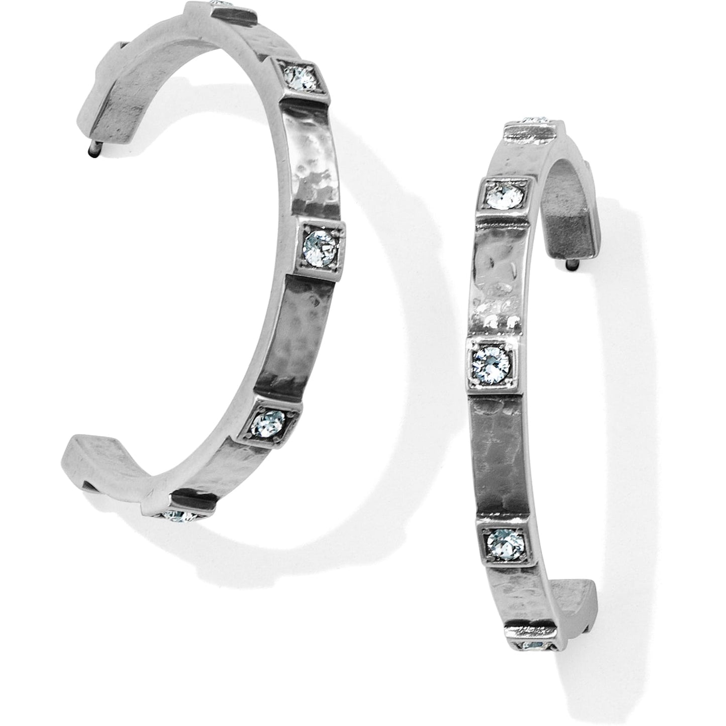 Brighton silver-plated hoop earrings with hammered texture and square crystal accents along the band on a white background