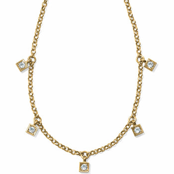 Brighton gold-plated chain necklace with five small square crystal stations spaced along the front on a white background