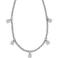Brighton necklace with silver-plated rolo chain and five small dangling square charms on a white background
