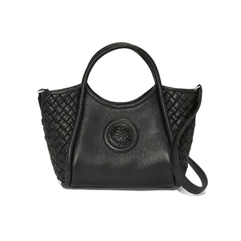 Brighton handbag in black leather with woven side panels, circular medallion emblem, dual handles, and shoulder strap on a white background