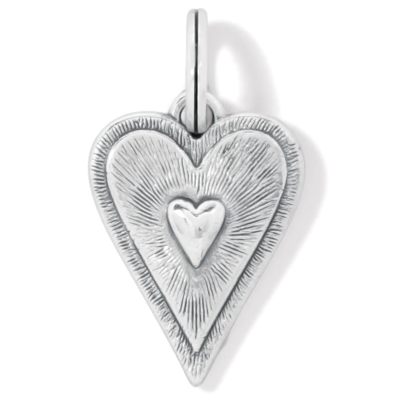 Brighton heart charm with silver-plated finish, radiating textured rays and raised center heart on a white background