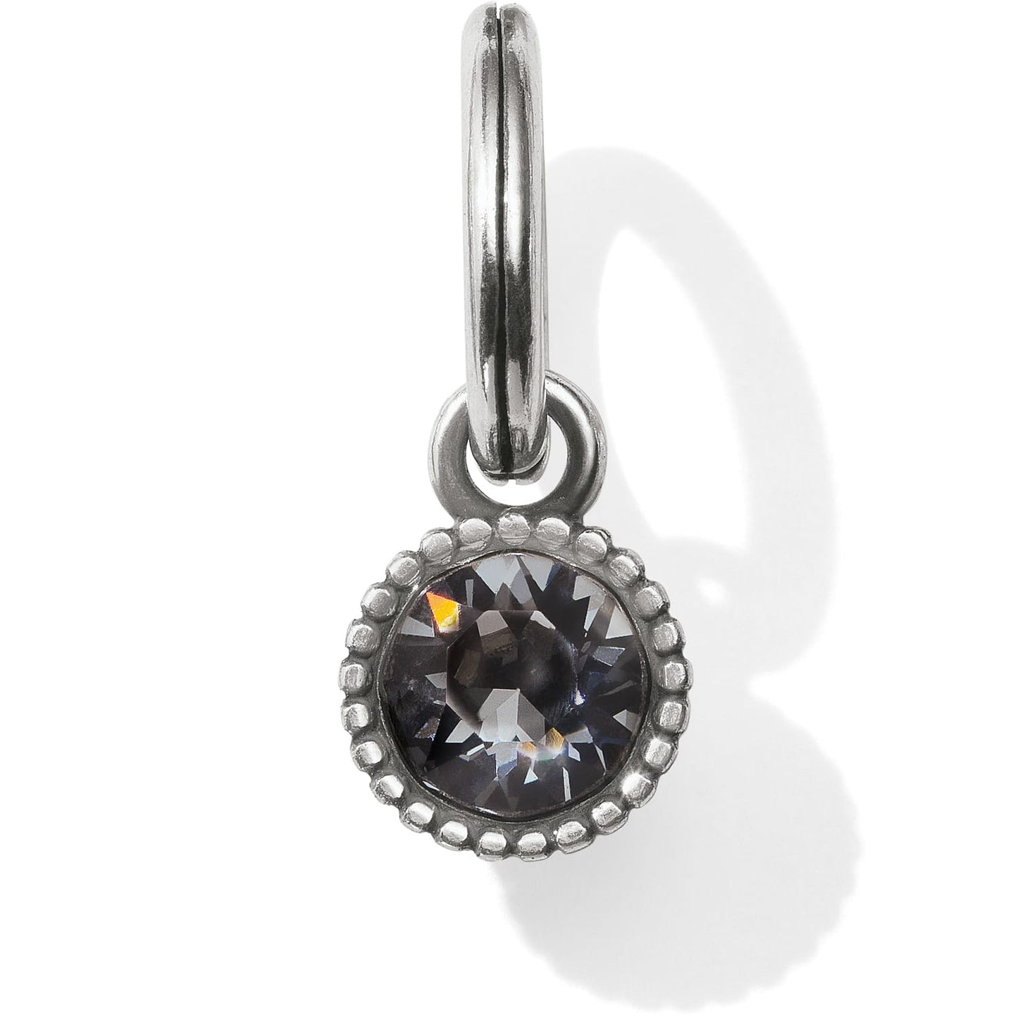 Brighton charm with round faceted crystal in beaded silver-plated setting on split ring on a white background
