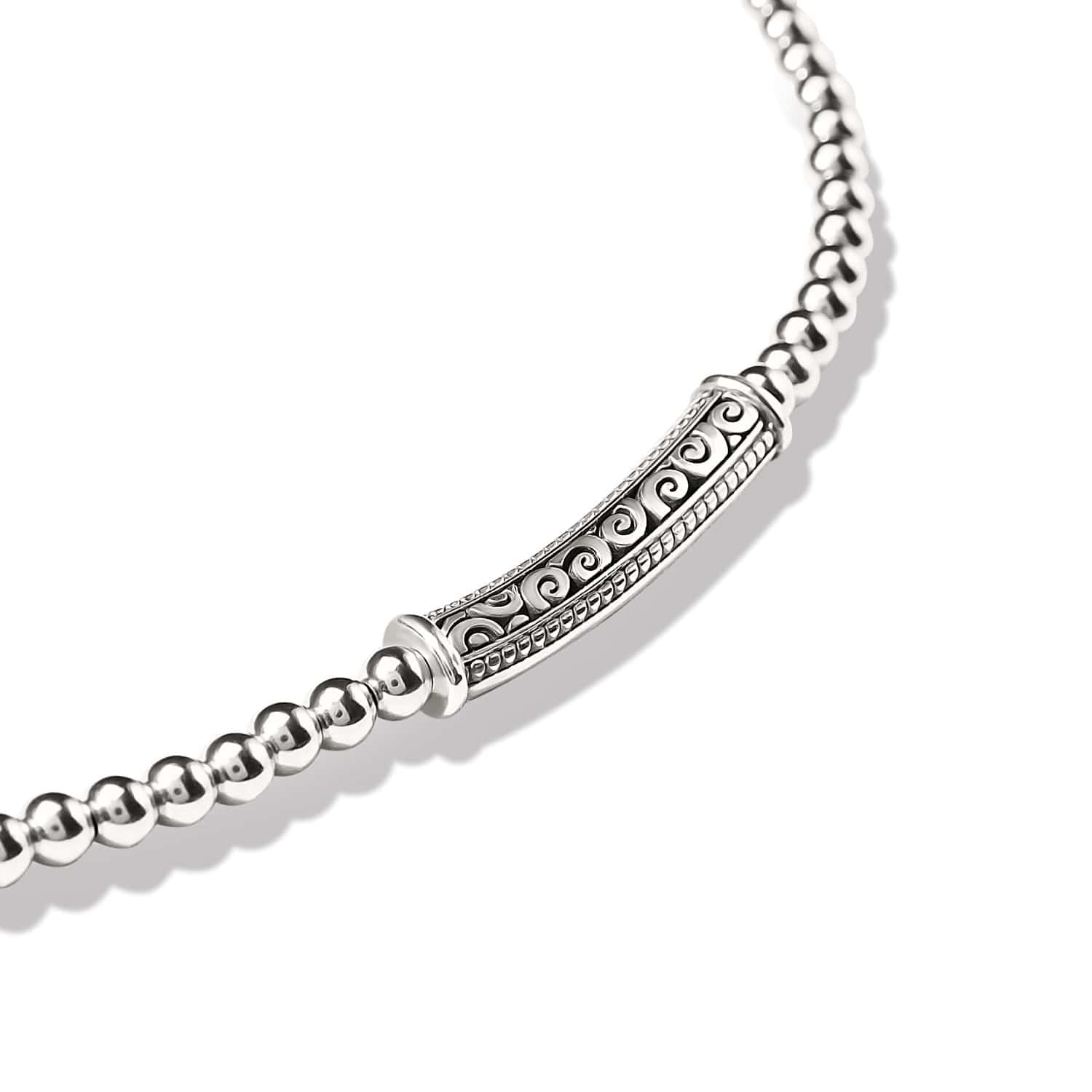 Close-up of Brighton silver-plated beaded bracelet with ornate scrollwork bar station featuring intricate filigree detailing