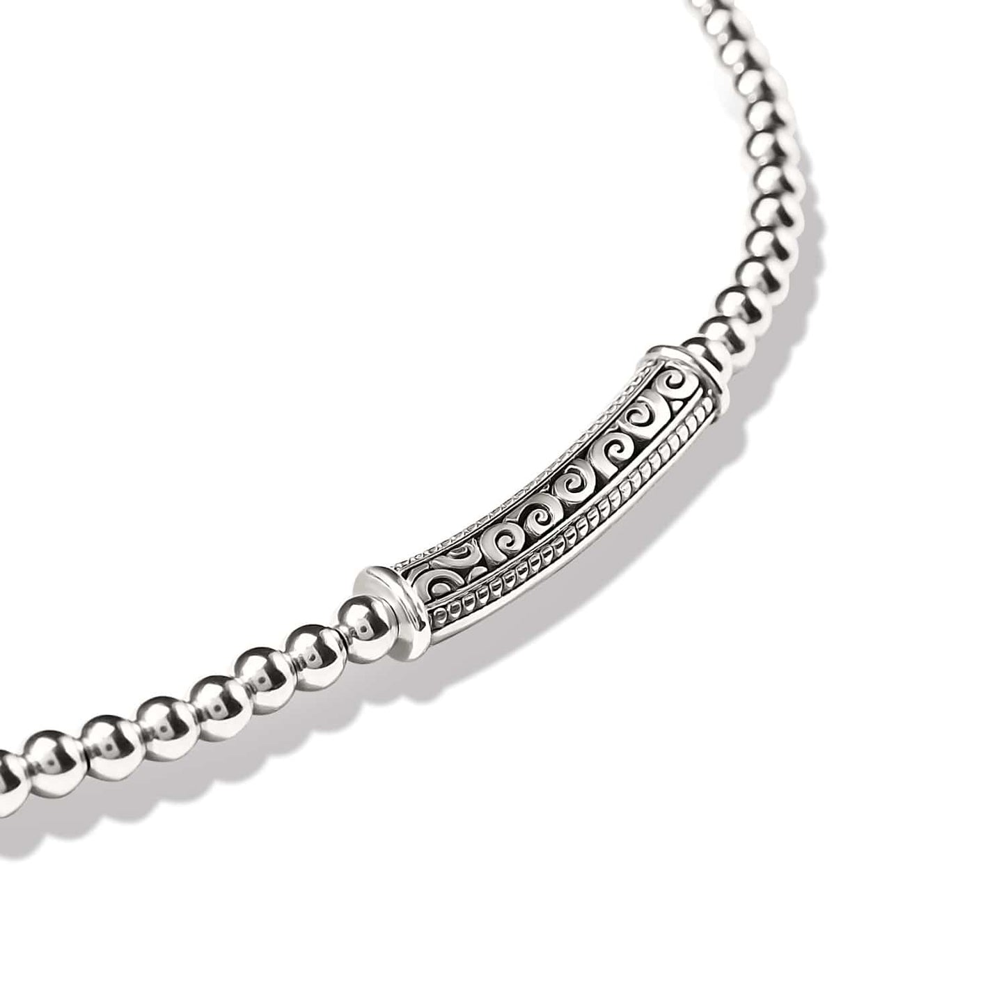 Close-up of Brighton silver-plated beaded bracelet with ornate scrollwork bar station featuring intricate filigree detailing