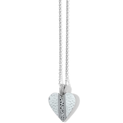 Brighton pendant necklace with hammered silver-plated heart and scroll detail on delicate chain on a white background