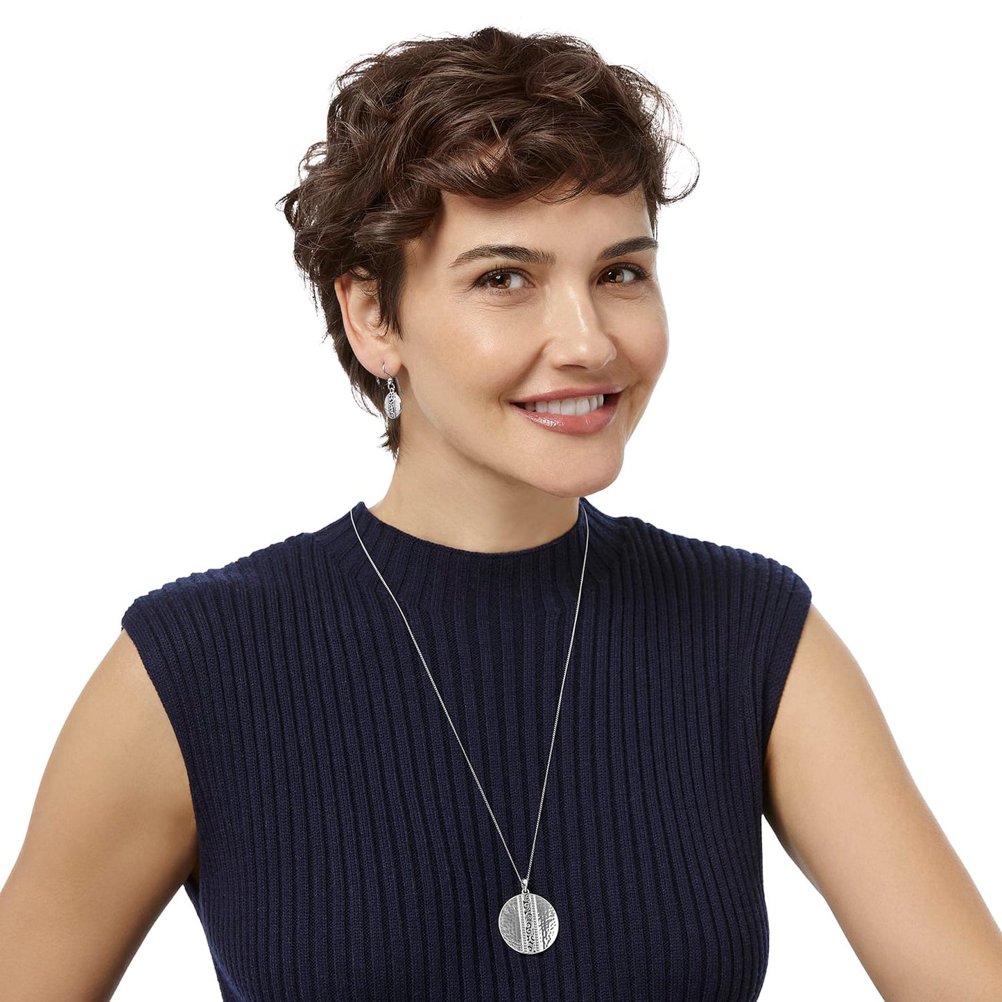 Model wearing a Brighton silver-plated pendant necklace with hammered round disc paired with matching drop earrings