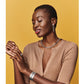 Model wearing a Brighton silver-plated link necklace with matching drop earrings and engraved silver-plated cuff bracelet