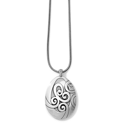 Brighton pendant necklace with silver-plated teardrop pendant featuring swirl motifs on a snake chain, on a white background