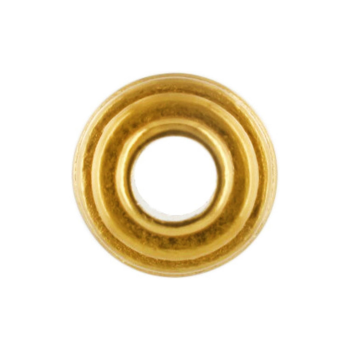 Brighton bead with gold-tone finish and ridged concentric rings around a central opening on a white background