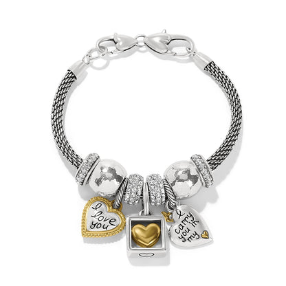 Brighton charm bracelet with silver-plated mesh chain, crystal beads, and gold-plated heart charms on a white background
