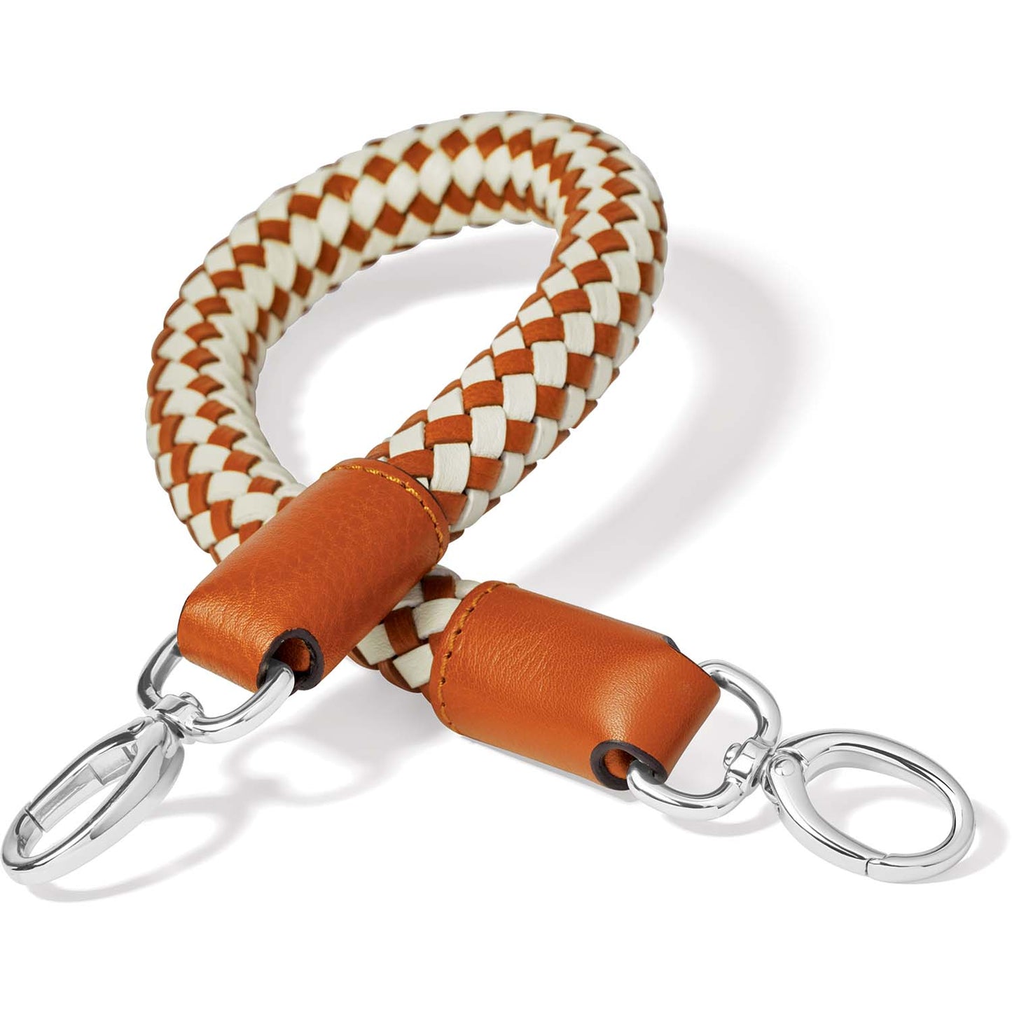 Brighton wristlet strap with braided orange and cream leather and silver-tone clasps on a white background