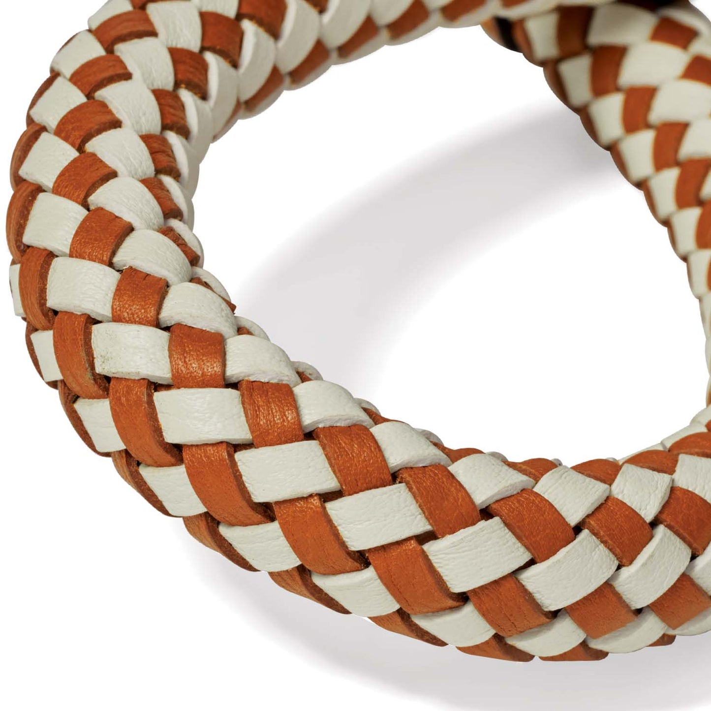 Close-up of Brighton bracelet with braided tan and white leather strands in a woven checkered pattern