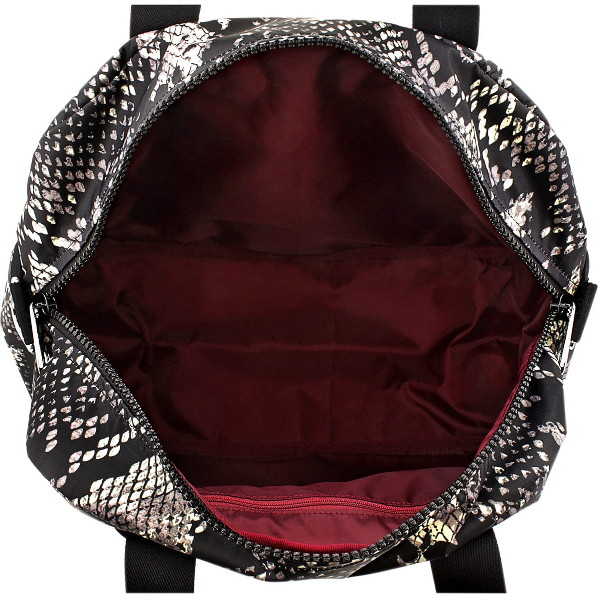 Close-up of Brighton handbag interior view showing burgundy lining, zippered pocket, and snake-print exterior trim