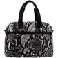 Brighton handbag with black and white snakeskin print, black dual top handles, and front zip pocket on a white background
