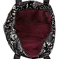 Close-up of Brighton handbag interior with burgundy lining, zippered pocket, and black snakeskin print exterior