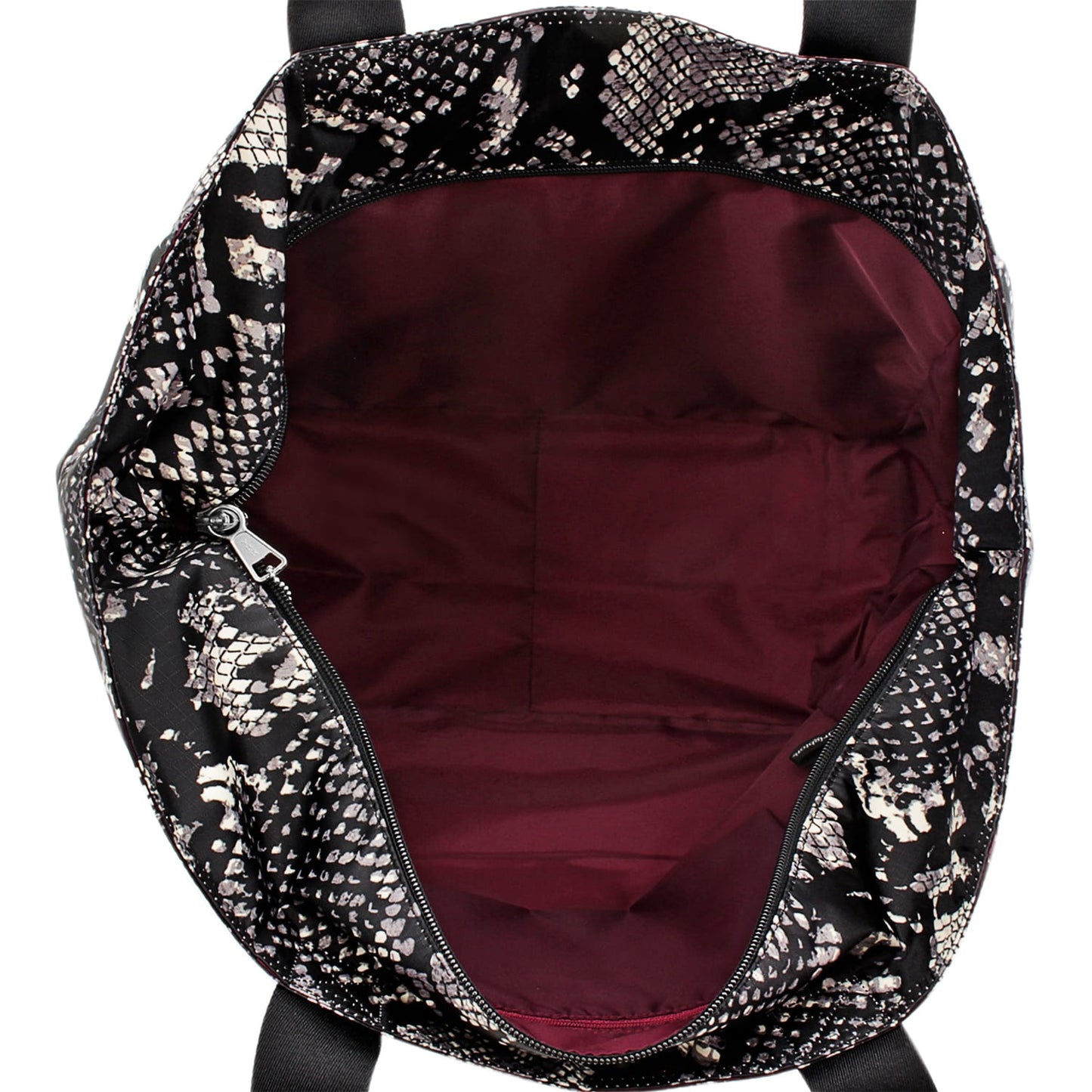 Close-up of Brighton handbag interior with burgundy lining, zippered pocket, and black snakeskin print exterior