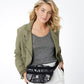 Model with a Brighton belt bag in black and white snakeskin print with silver-tone heart hardware