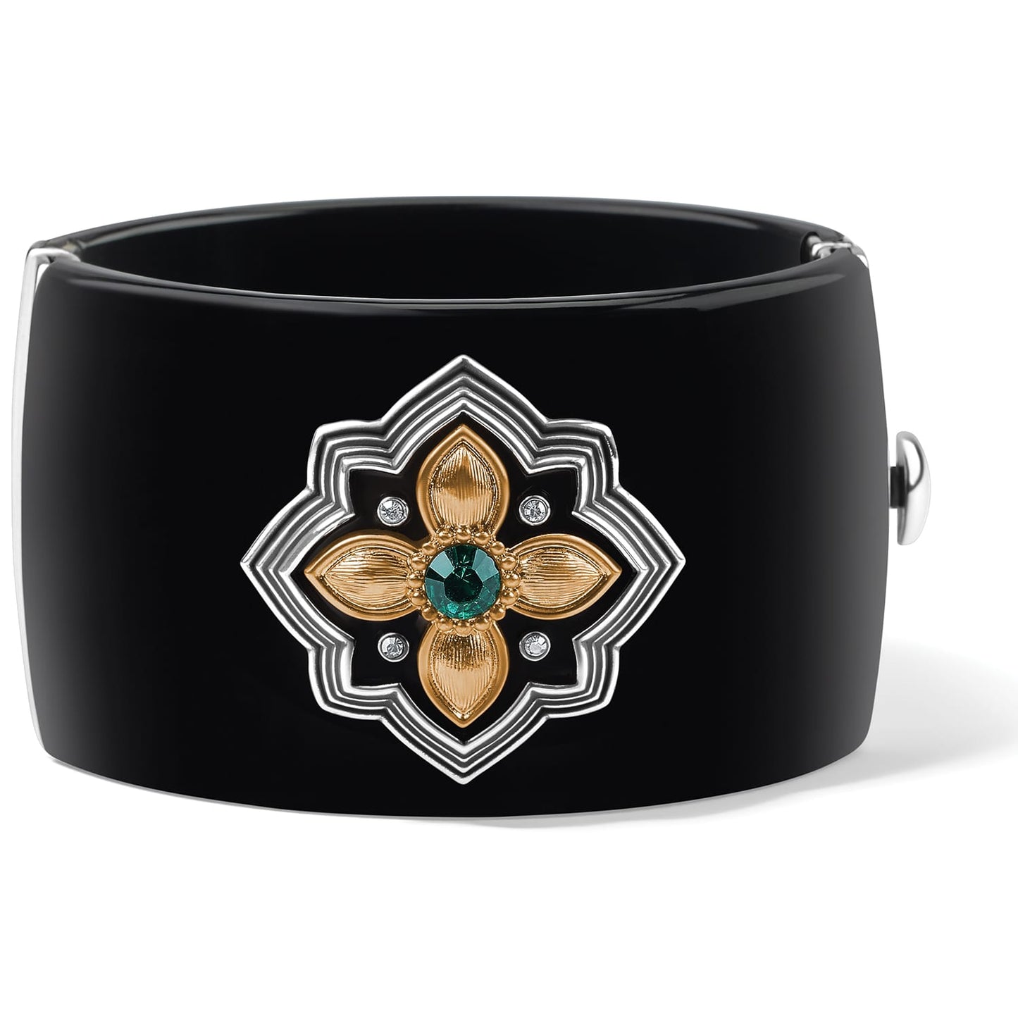 Brighton black hinged cuff bracelet with two-tone floral medallion, green crystal center, and clear crystals on a white background