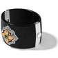 Brighton black cuff bracelet with gold flower medallion, silver accents, and green crystal center on a white background