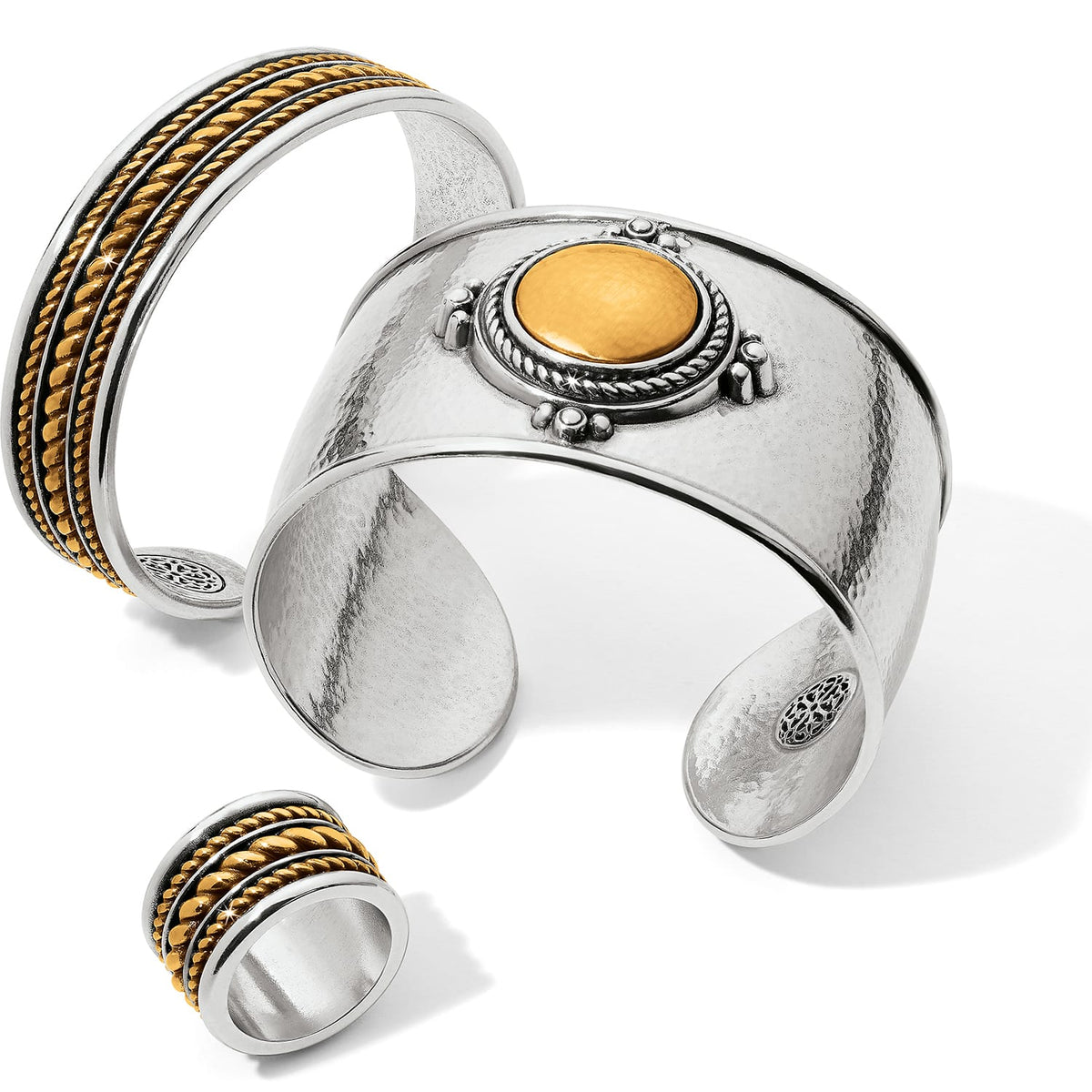 Brighton two-tone cuff bracelets and ring with hammered silver finish, gold rope details, and round medallion on white background